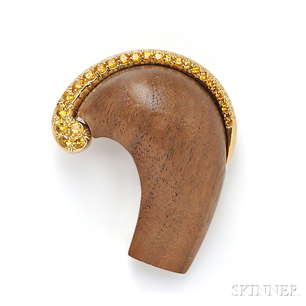 Appraisal: kt Gold Carved Wood and Yellow Sapphire Brooch Seaman Schepps