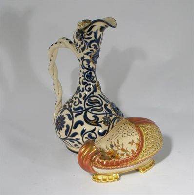 Appraisal: A Zsolnay Pecs earthenware centrepiece reticulated and painted with stylised