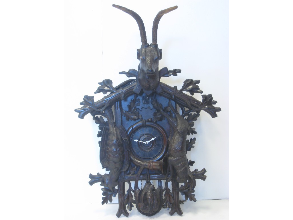 Appraisal: A carved black forest Cuckoo Clock with carved deer hare