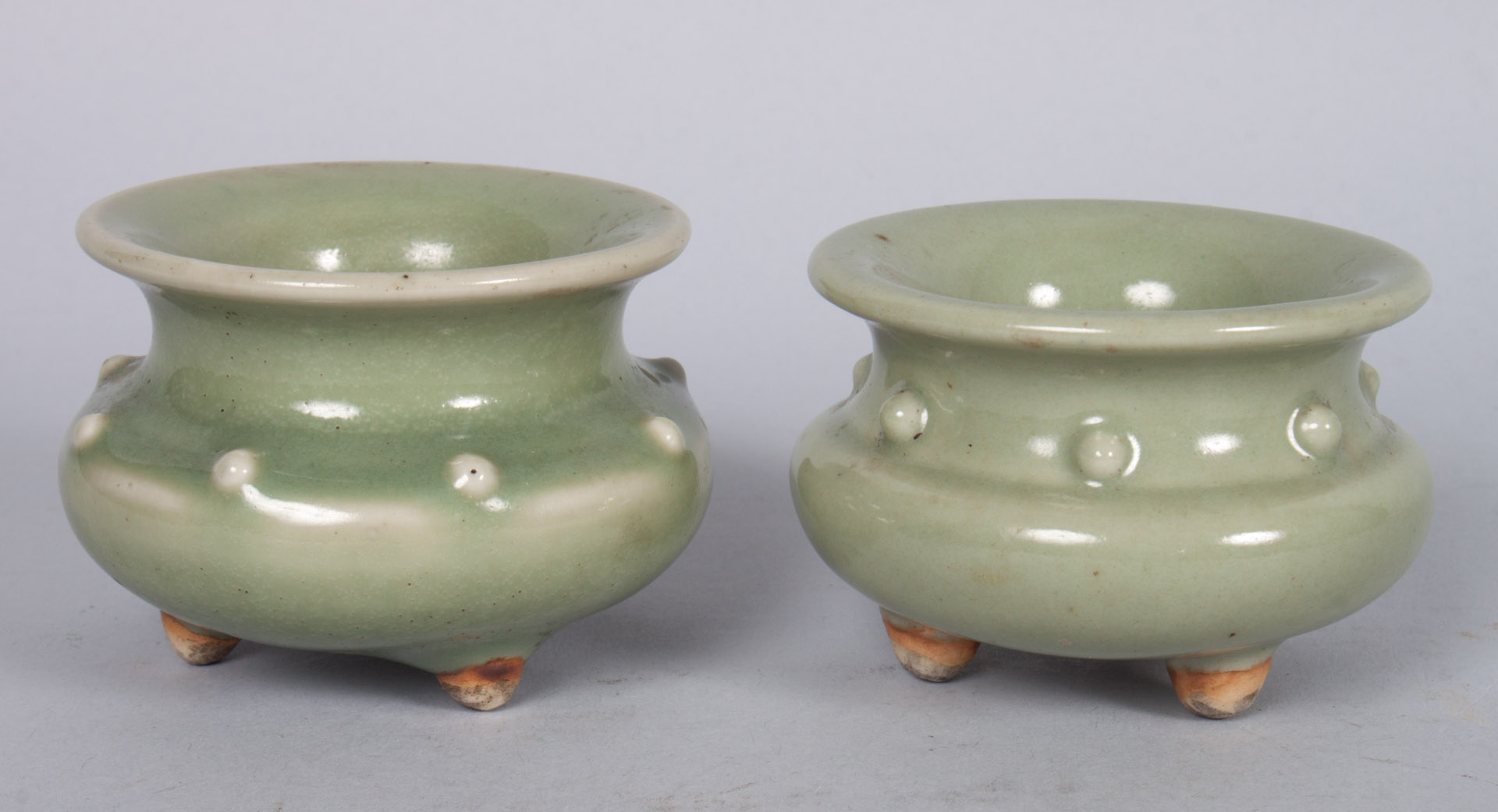 Appraisal: Pair of Chinese celadon porcelain water dippers in H in