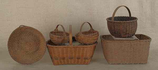 Appraisal: Pennsylvania rye straw basket together with two God's eye baskets