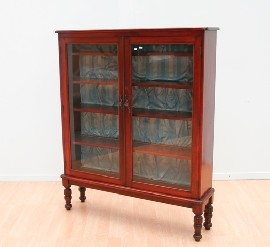 Appraisal: A mahogany glazed display cabinet on legs th century