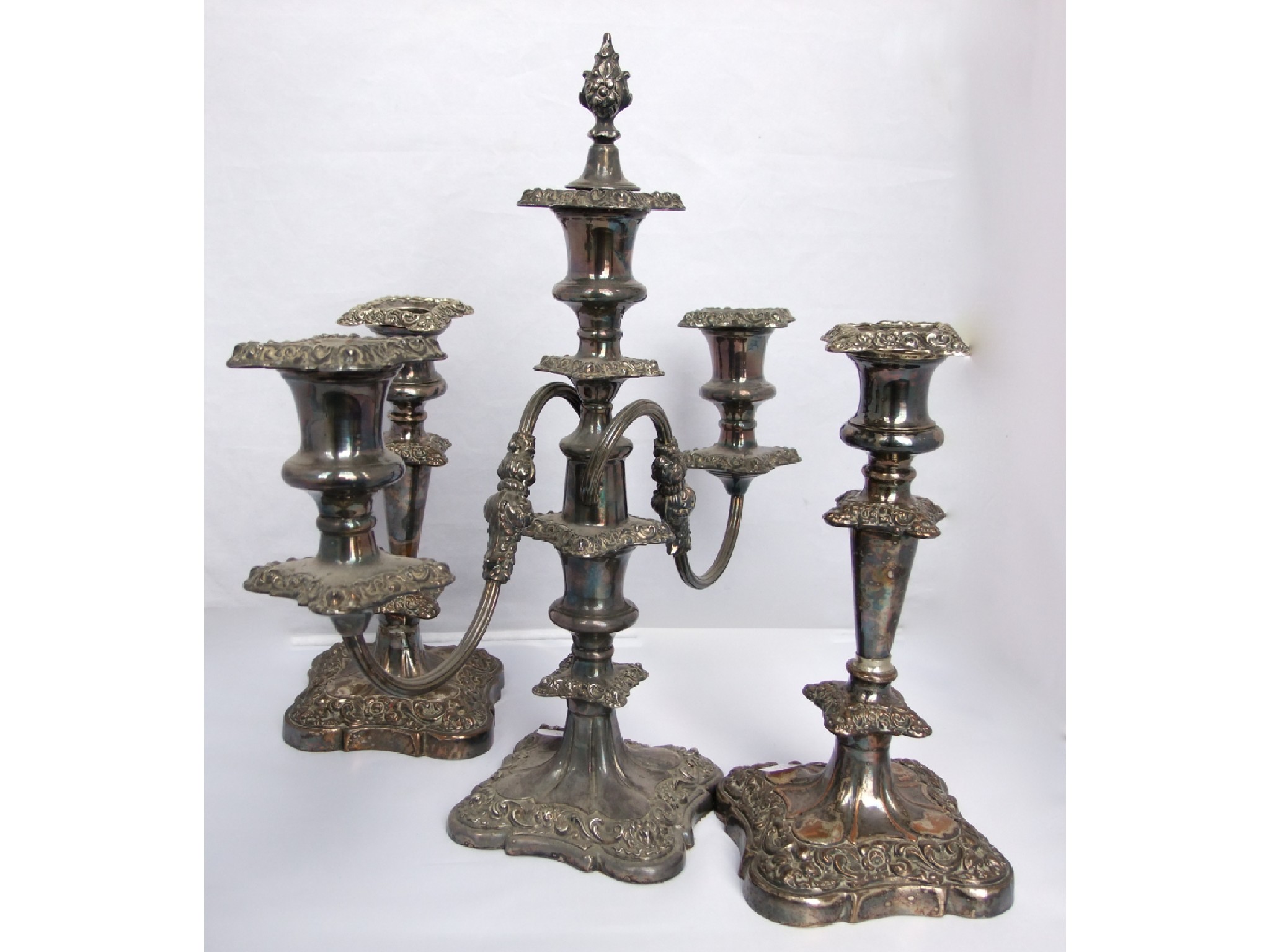 Appraisal: A silver plated candelabra garniture a three divisional candelabrum with