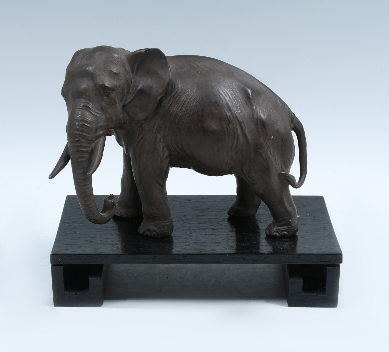 Appraisal: SIGNED JAPANESE BRONZE ELEPHANT ON STAND A well-executed Japanese bronze