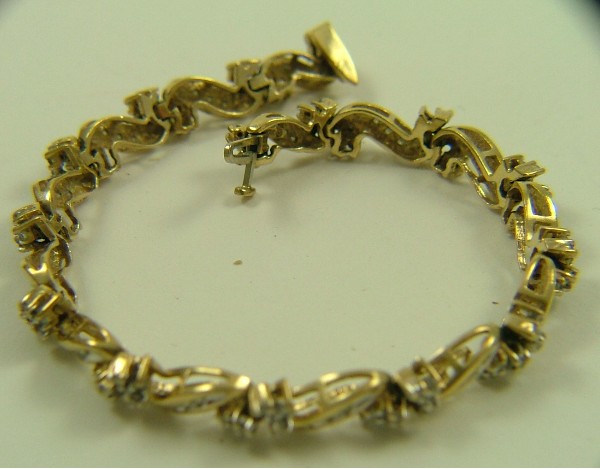 Appraisal: DIAMOND AND TEN KARAT GOLD BRACELET in length and set