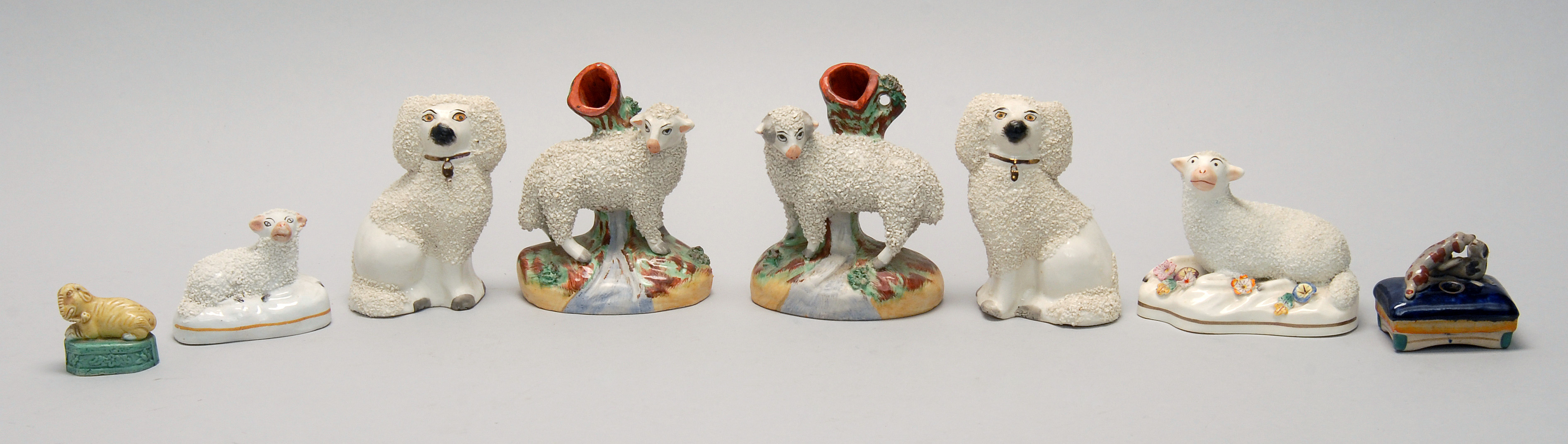 Appraisal: EIGHT CERAMIC ANIMALS two Staffordshire dogs four Staffordshire sheep Chinese