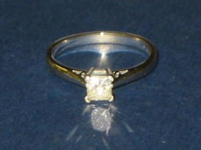 Appraisal: A SOLITAIRE DIAMOND RING the princess cut stone approximately cts