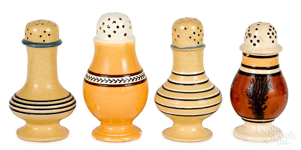 Appraisal: Four mocha and yellowware pepper pots Exclusive on Bidsquare Four