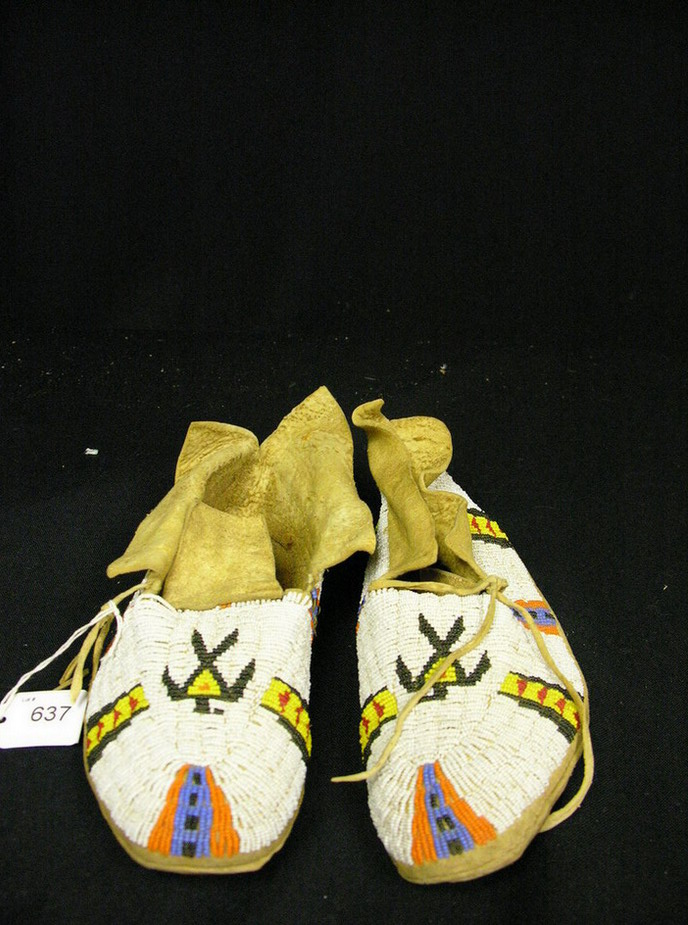 Appraisal: NATIVE AMERICAN BEADED MOCCASINS THUNDERBIRD Hand sewn brain tanned leather