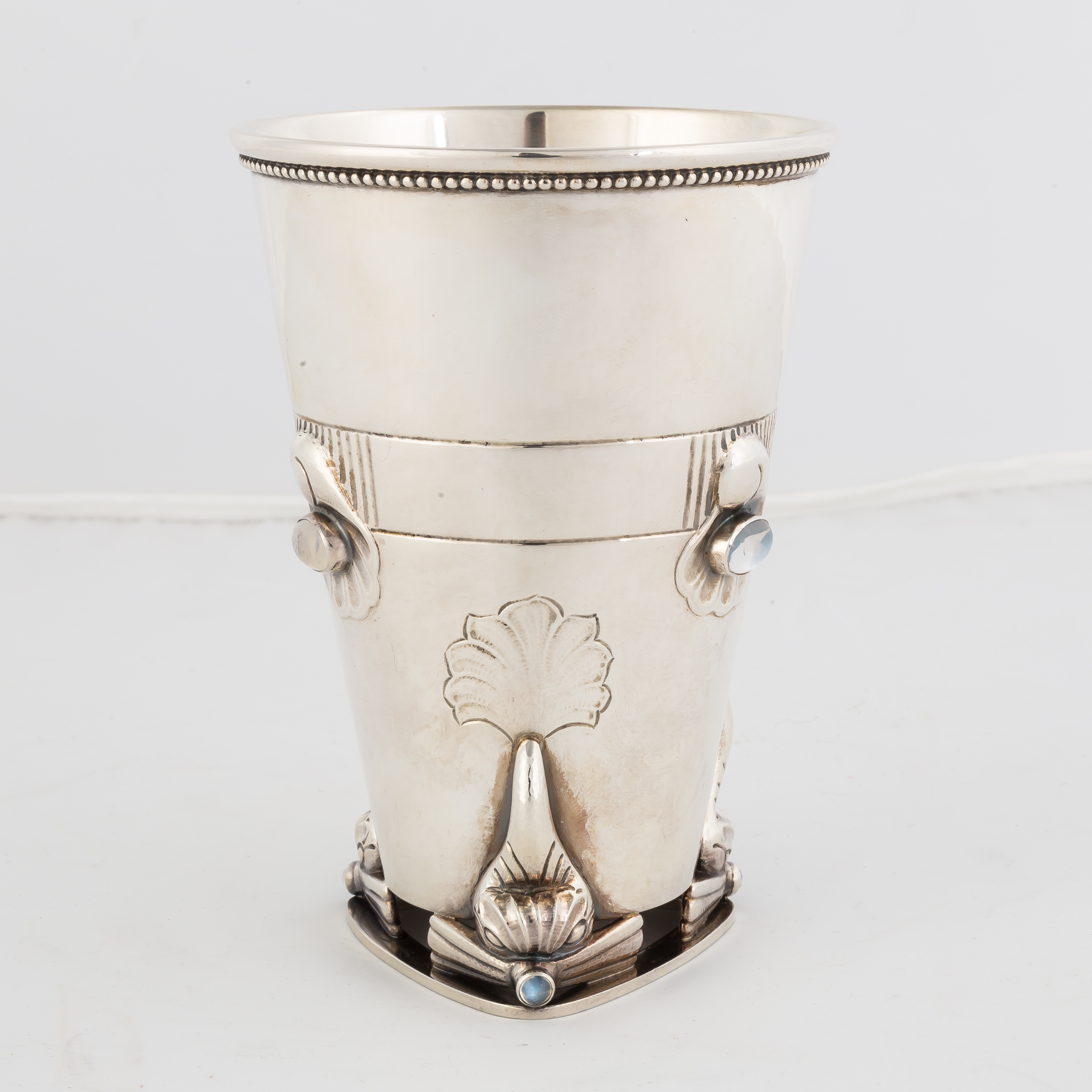 Appraisal: Georg Jensen Sterling Silver Beaker Hand chased with three dolphins