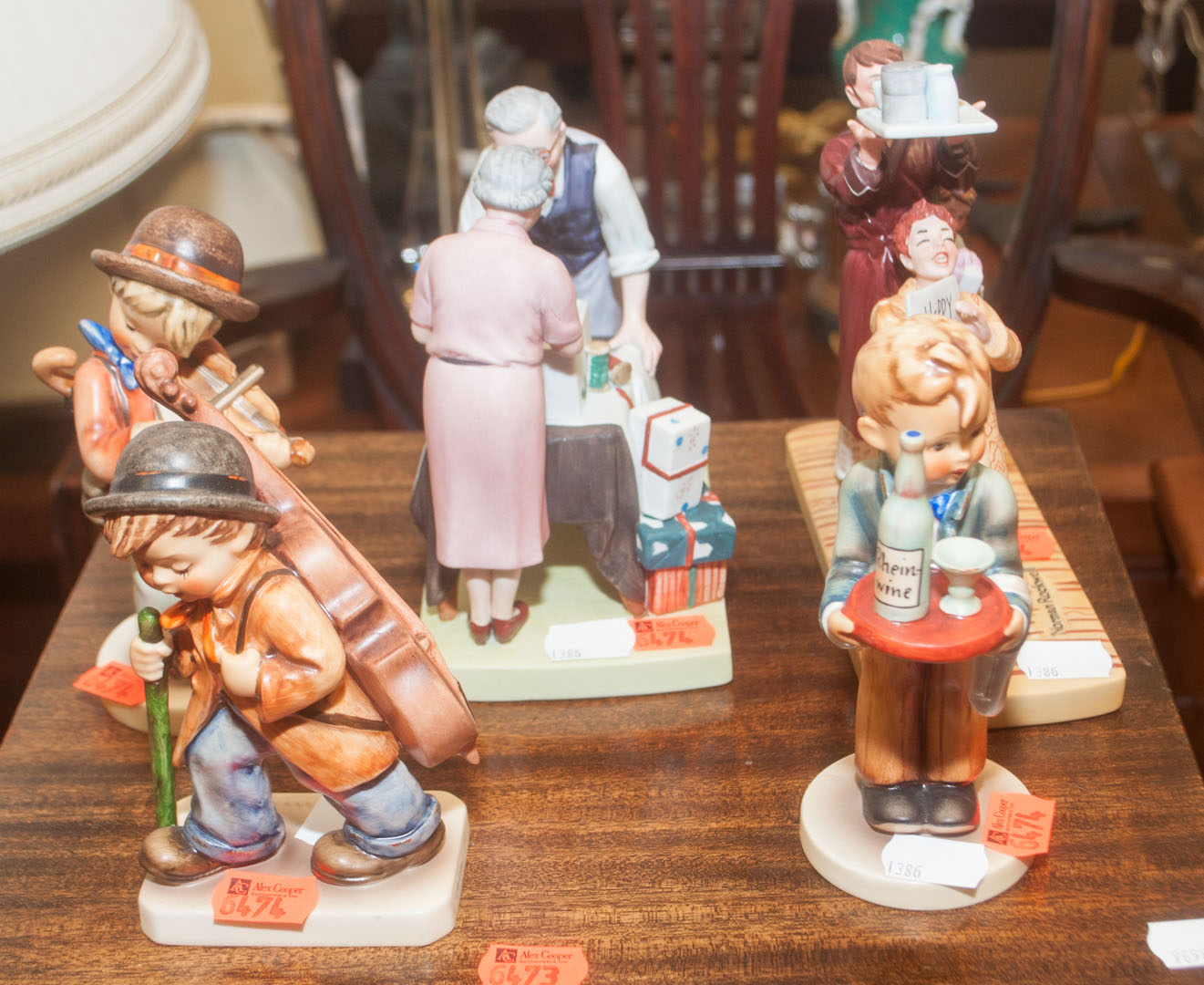 Appraisal: Five assorted figurines including three Hummels and two Norman Rockwell