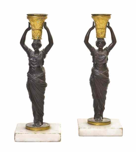 Appraisal: A Pair of Empire Gilt and Patinated Bronze Figural Candlesticks