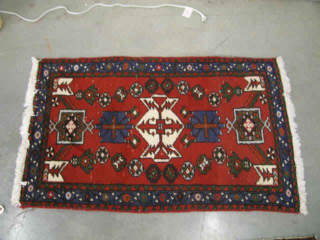 Appraisal: Hamadan Persian Handmade Rug stylized florals and geometrics primarily reds