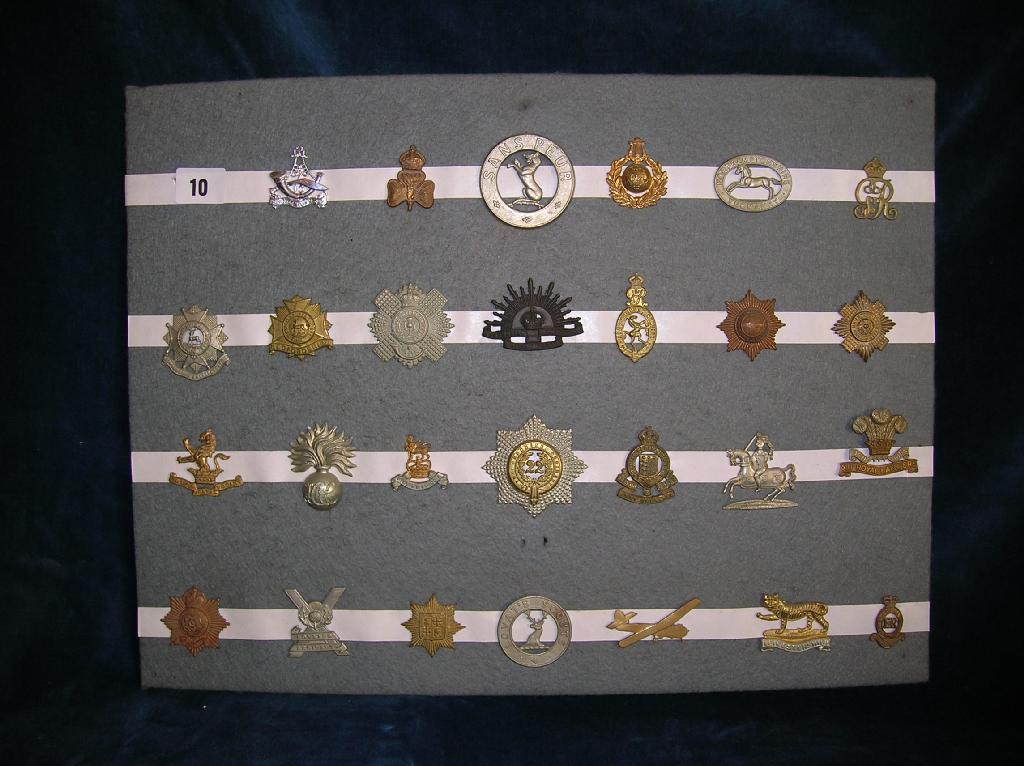 Appraisal: A collection of assorted British military cap badges on card