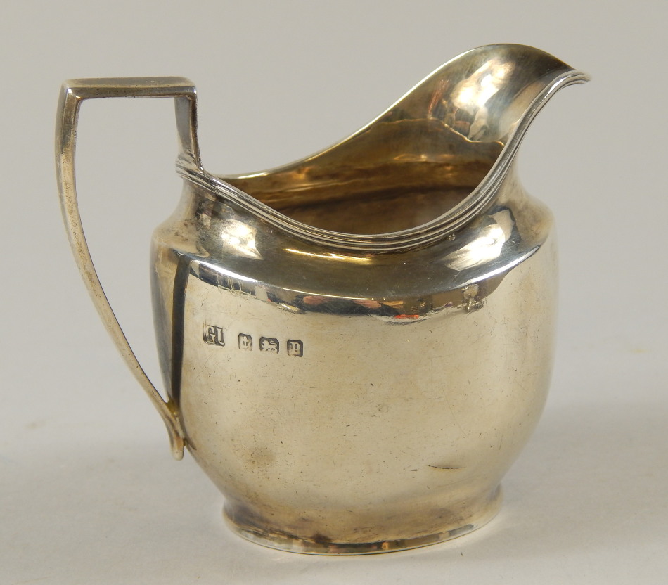 Appraisal: A George V silver milk jug with a plain angular