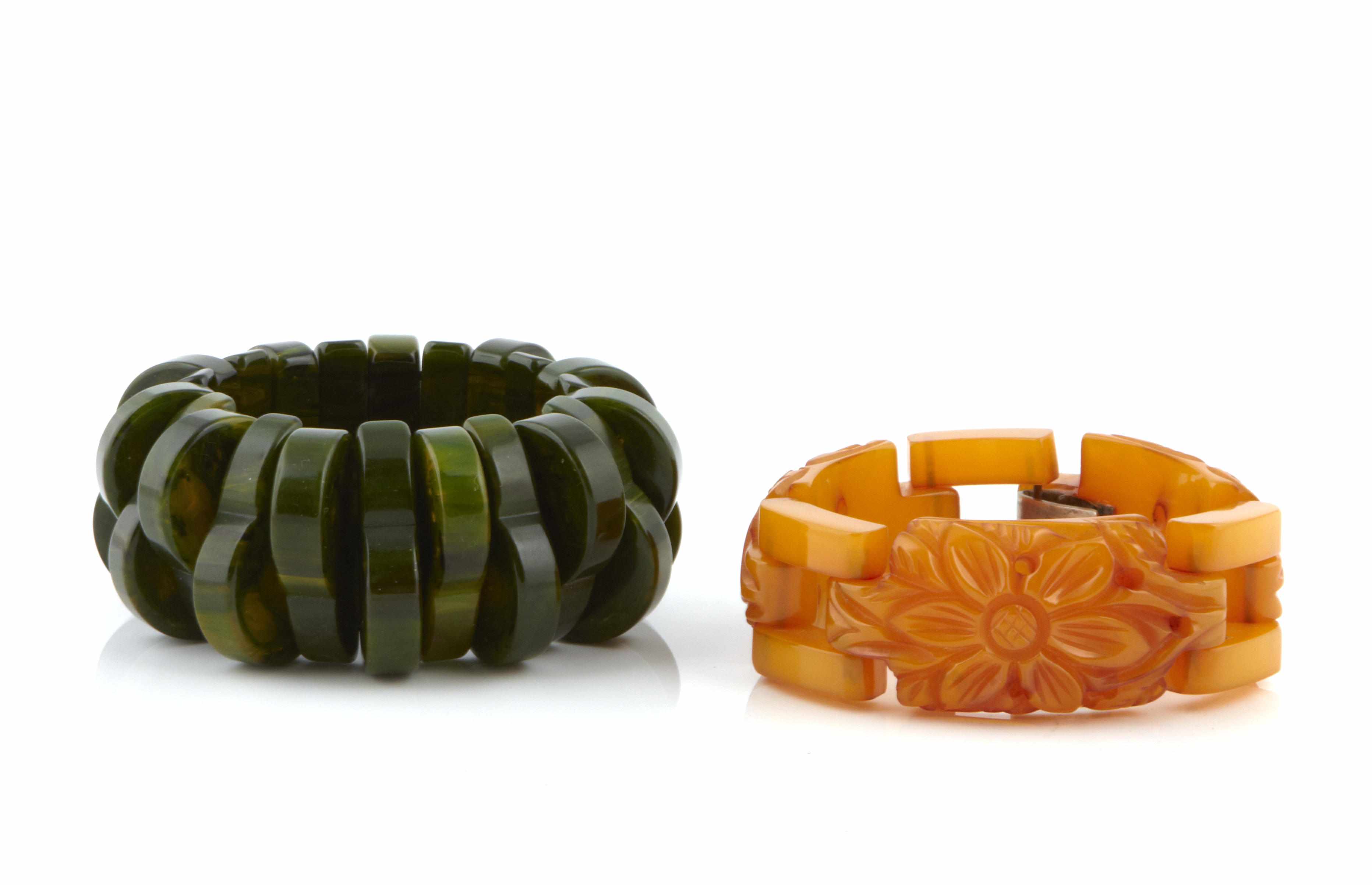 Appraisal: Two Bakelite bracelets carved butterscotch and green marble length in