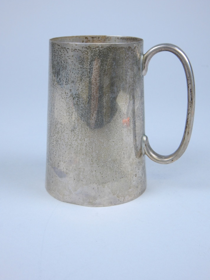 Appraisal: An Edwardian plain tapering cylindrical silver tankard Sheffield oz cm