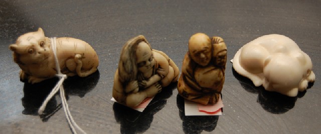 Appraisal: A COLLECTION OF JAPANESE IVORY AND BONE NETSUKE Comprising three