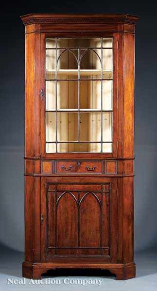 Appraisal: An Antique American Carved Mahogany Corner Cabinet th c dentil