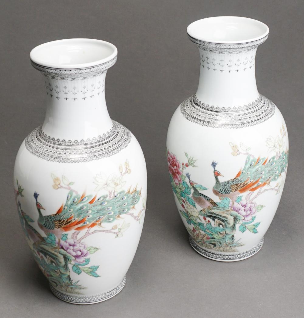 Appraisal: PAIR OF JAPANESE PEACOCK ON BRANCH PORCELAIN VASES H IN