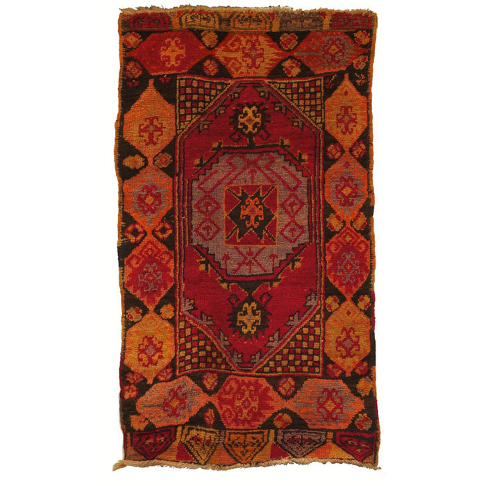 Appraisal: Turkish rug c central medallion on a red field minor