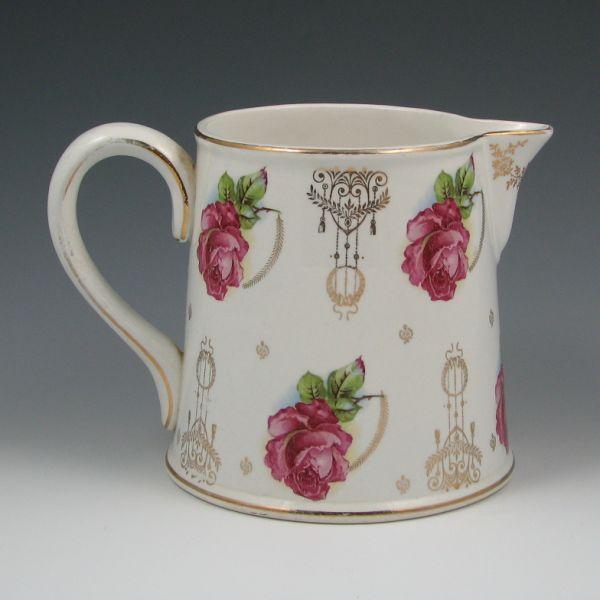 Appraisal: Homer Laughlin pitcher with rose decoration and gilded design Marked