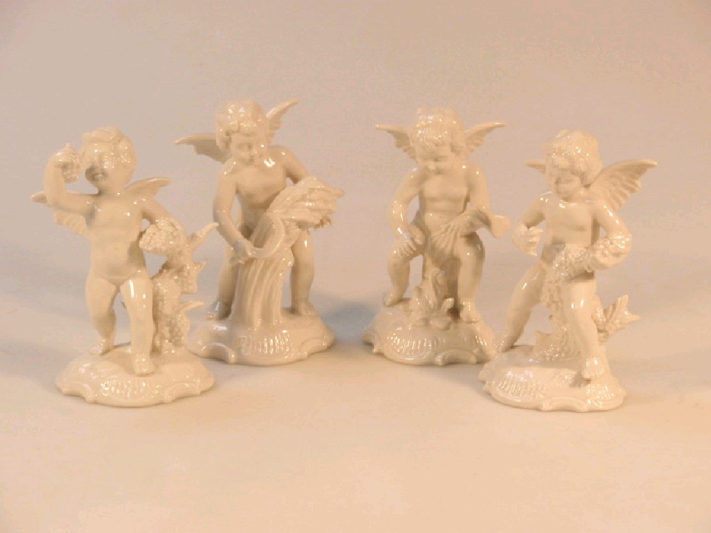 Appraisal: A set of four thC German porcelain putti glazed in