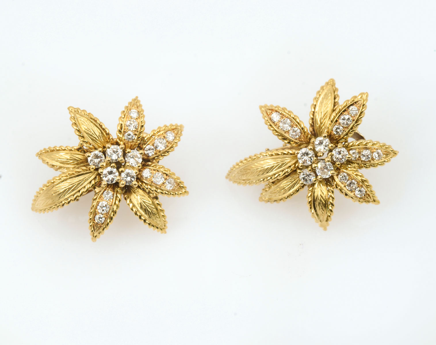 Appraisal: K MID CENTURY DIAMOND EAR CLIPS Elegantly crafted yellow gold