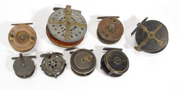 Appraisal: Collection of mixed early wooden and brass fishing reels including