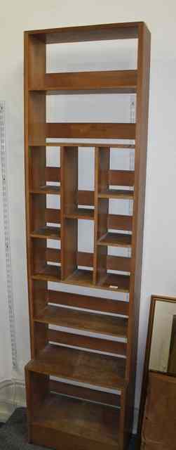 Appraisal: A COTSWOLD SCHOOL TALL OPEN OAK BOOKCASE with various shelves