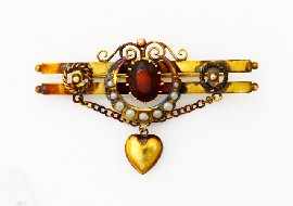 Appraisal: An Edwardian ct gold garnet and seed pearl bar brooch