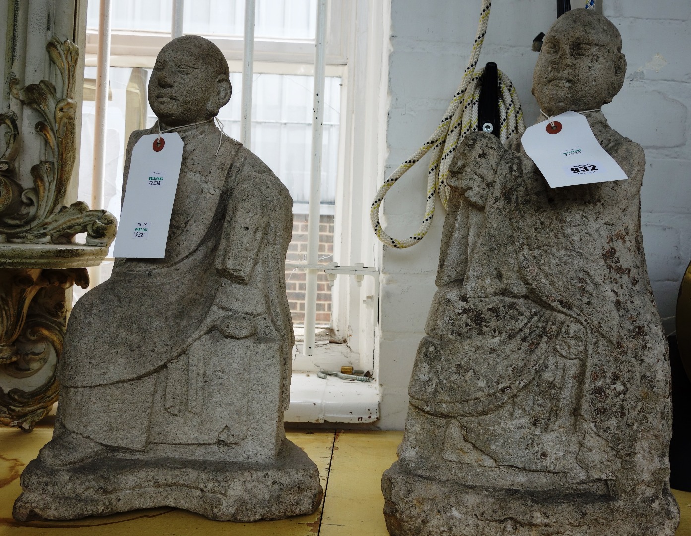 Appraisal: A pair of Chinese carved stone figures each in a