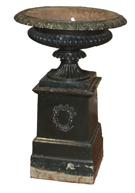 Appraisal: A Victorian cast iron garden urn and pedestal the gadrooned