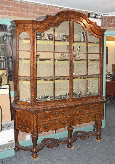 Appraisal: A DUTCH FIGURED WALNUT VITRINE IN TWO PARTS the interior