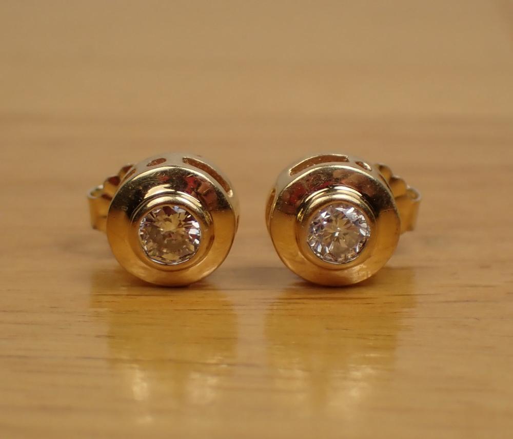 Appraisal: PAIR OF DIAMOND AND FOURTEEN KARAT GOLD EAR STUDS each