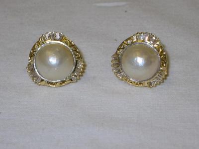 Appraisal: A PAIR OF PEARL MABE AND DIAMOND STUD EARRINGS with