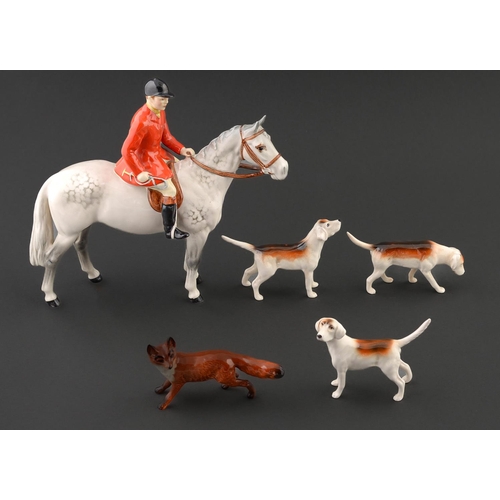 Appraisal: A Beswick equestrian figure of a fox hunter a fox