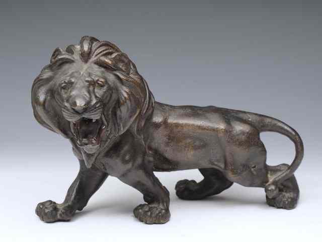 Appraisal: A JAPANESE BRONZE MODEL of a standing lion Meiji period