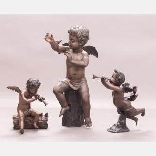 Appraisal: A Group of Three Brass Cherub Figures th Century A