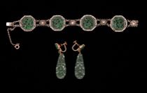 Appraisal: Jade Bracelet Ear Pendants Jade bracelet has four caved medallions