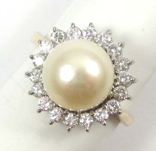 Appraisal: PEARL DIAMOND AND FOURTEEN KARAT GOLD RING with round-cut diamonds