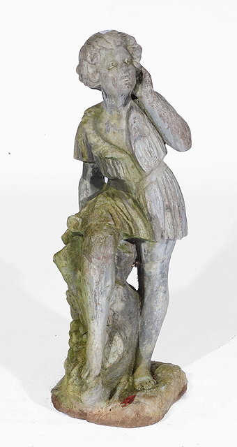 Appraisal: A lead garden statue in the form of a boy