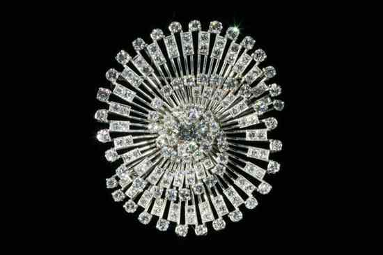 Appraisal: PLATINUM AND DIAMOND SPIRAL DESIGN BROOCH App brilliant-cut round diamonds