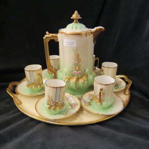 Appraisal: Limoges Porcelain Chocolate Set with Tray handpainted floral elaborate gold