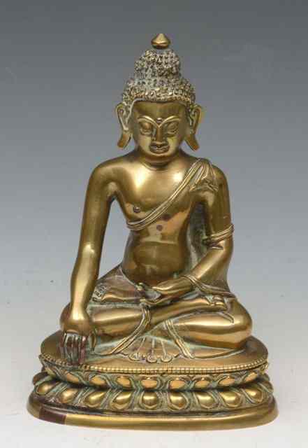 Appraisal: A SINO-TIBETAN BRONZE MODEL OF A BUDDHA seated in dhyanasana