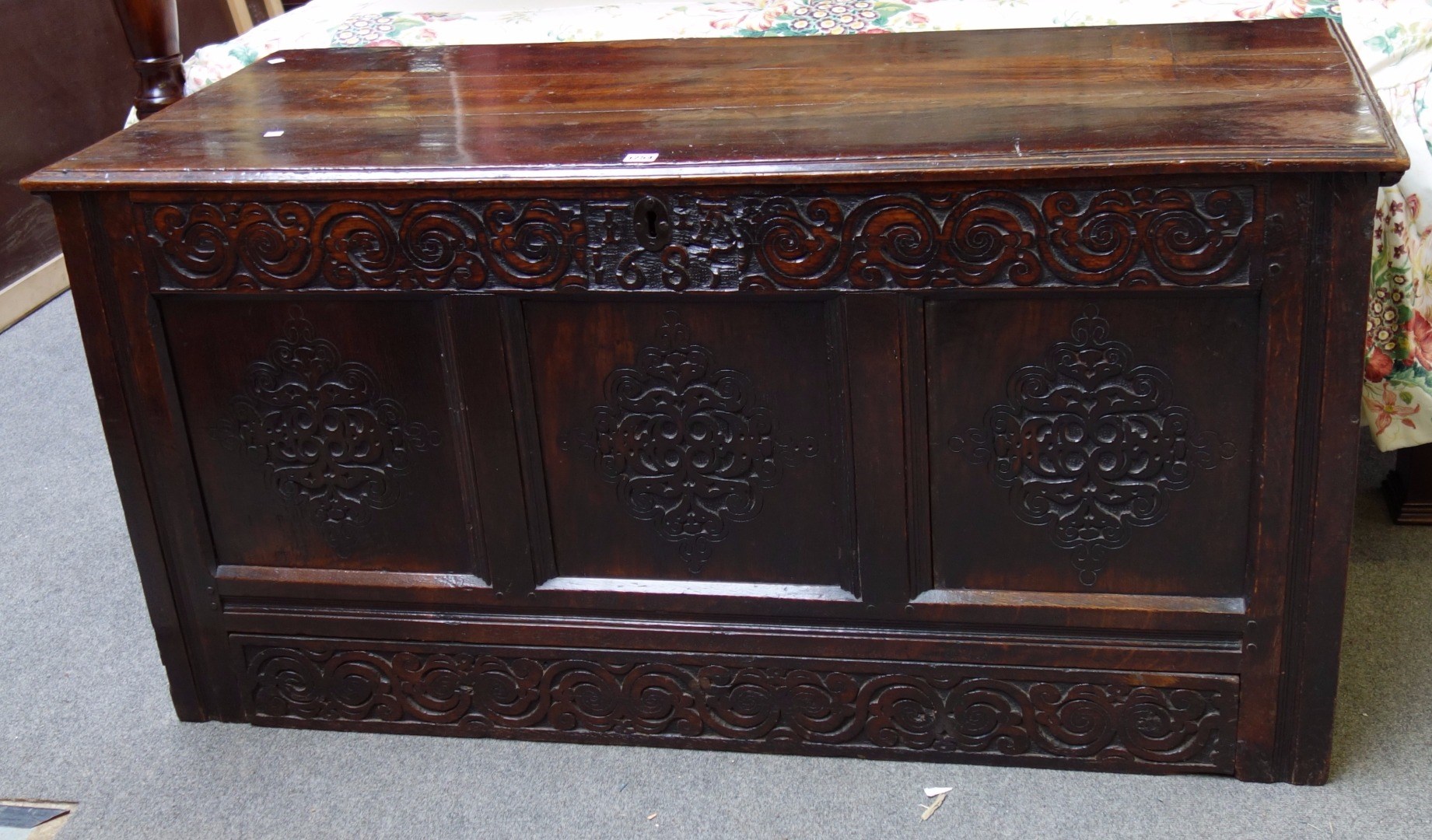 Appraisal: A Charles II oak coffer the plank top over carved