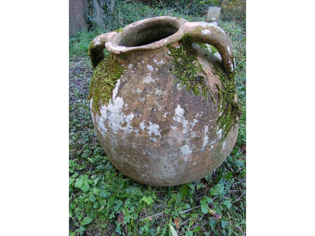 Appraisal: A weathered terracotta olive jar AF