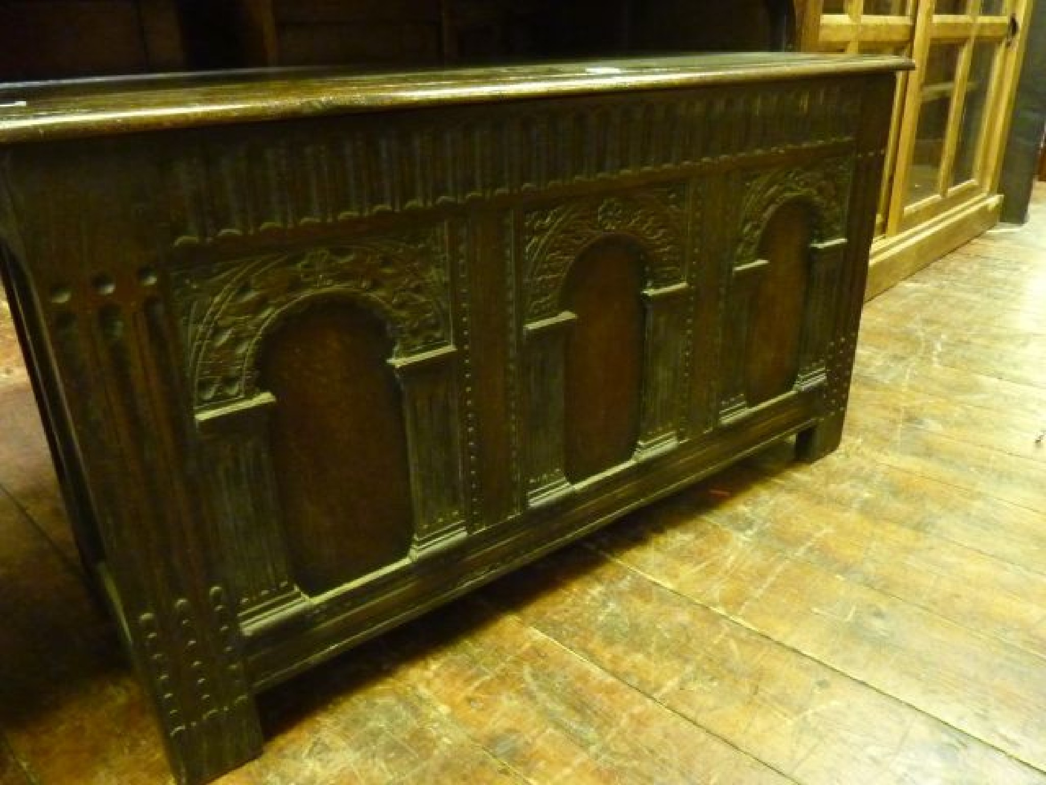 Appraisal: An old English oak coffer the front elevation with three