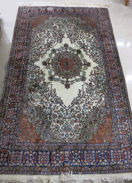 Appraisal: HAND KNOTTED ORIENTAL CARPET Pakistani Persian floral and floral medallion