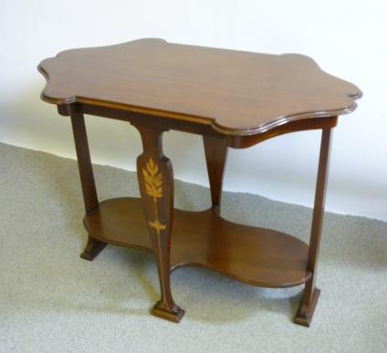 Appraisal: AN ART NOUVEAU MAHOGANY OCCASIONAL TABLE of shaped oval form